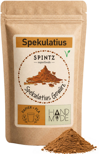 SPINTZ Spekulatiusgewürz im Kraftpapierbeutel mit braunem Gewürzpulver im Vordergrund.