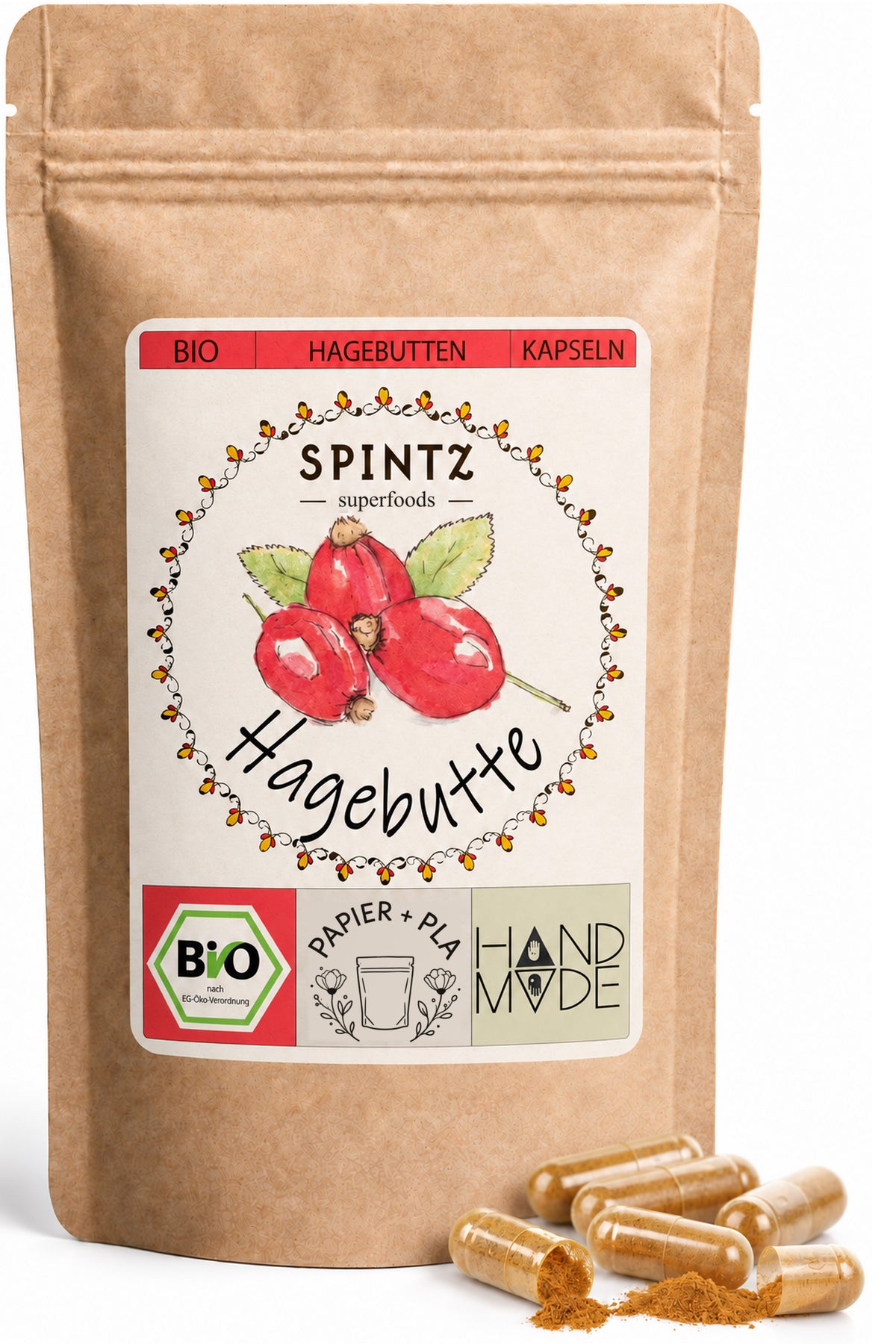 SPINTZ Bio-Hagebutten-Kapseln im Kraftpapierbeutel mit goldbraunen Kapseln im Vordergrund.