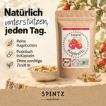 SPINTZ Bio-Hagebutten-Kapseln mit reinem Hagebuttenpulver, dargestellt mit Pulverschale und Hagebuttenzweigen.